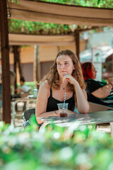 curly girl drinking coffee