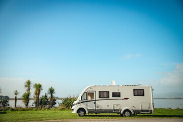 motorhome on a camping ground, caravan vacations, campervan trip - obrazy, fototapety, plakaty