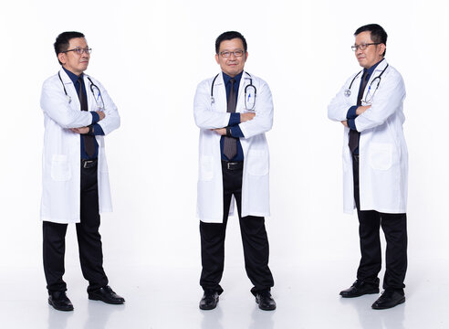 Full length 60s 50s Asian Senior man surgery medical Doctor, cross arms confident