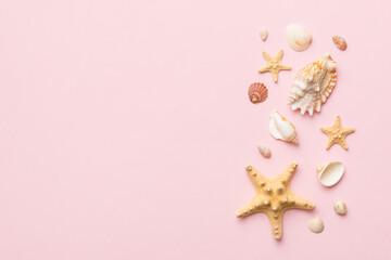 Summer time concept Flat lay composition with beautiful starfish and sea shells on colored table,...