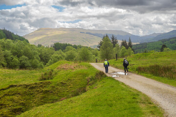 Fototapeta na wymiar Walkers on the West Highland Way between Tyndrum and the Bridge of Orchy.
