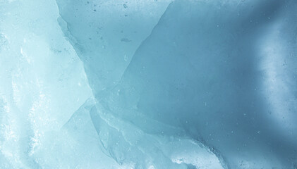 Abstract ice texture. A network of cracks on a piece of blue ice