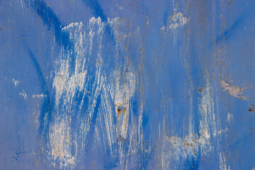 old painted blue cracked metal surface