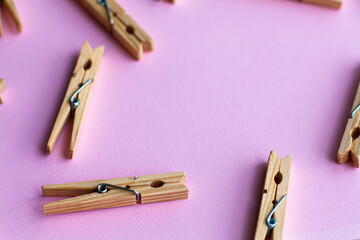Set of decorative clothespins on a pink background - 512785965