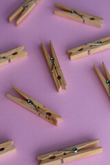 Set of decorative clothespins on a pink background - 512785966