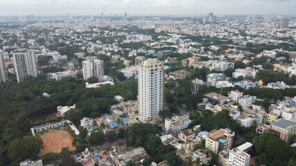 Fototapeta na wymiar Bangalore, India 24th March 2022: An aerial shot of Bangalore city with live traffic. The capital city of Karnataka drone view. The megacity of India. Cosmopolitan city.