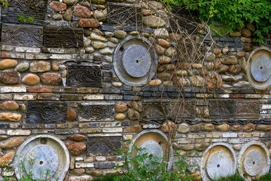 Landscape decorated with traditional stone mill in Chinese garden