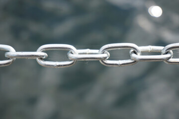 Silver metal chain, defocused background