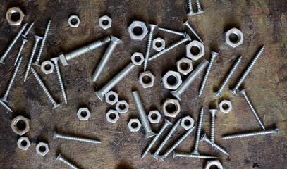 old nails screws and bolts on a background
