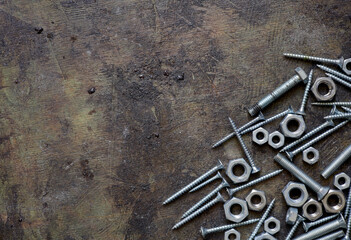 old nails screws and bolts on a background
