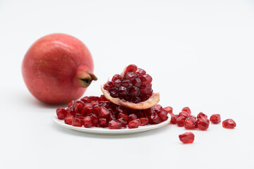 Fresh Pomegranate and seeds isolated on white background With clipping path.