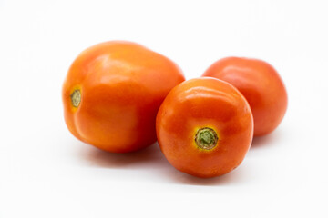 fresh tomatoes isolated on white background.