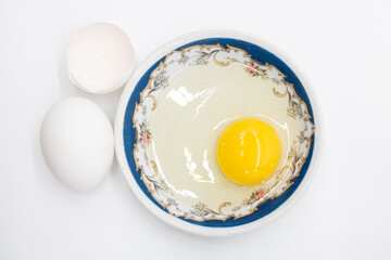 whole eggs and broken isolated on white background.