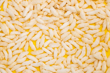 Puffed rice, Churmure or murmure or moori isolated on yellow background....