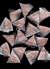 Close-up of tea bags on black background