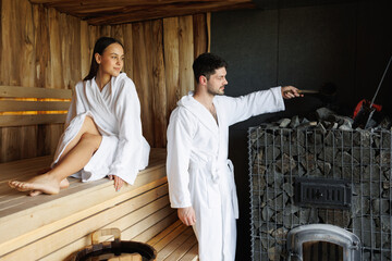 Man and woman relaxing in the sauna