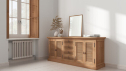 Blurred background, retro living room with wooden floor. Rattan chest of drawer with decor. Frame mock up. Window with shutters and radiator. Vintage interior design