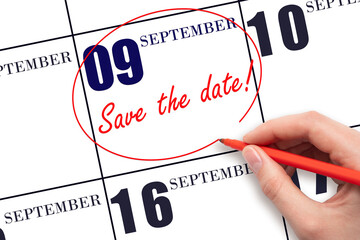 Hand drawing red line and writing the text Save the date on calendar date September 9.