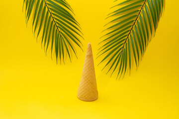 Summer scene with palm trees and ice cream cone upside down. Yellow background. 