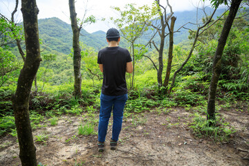 Fototapeta premium People remote control a flying drone in summer forest