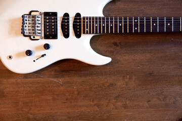 Fototapeta na wymiar White guitar on old wood