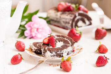 Delicious pieces of homemade chocolate biscuit with summer strawberries on the , table