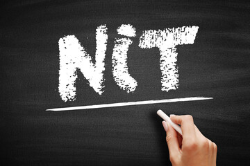 NIT - Negative Income Tax is a system which reverses the direction in which tax is paid for incomes below a certain level, acronym business concept on blackboard - obrazy, fototapety, plakaty