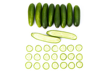 Delicious cucumbers, one sliced and one halved. Tasty vegetables © luismicss