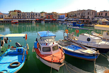 Fototapeta na wymiar Fishing boats in port at town Rethymno in crete island at Greece