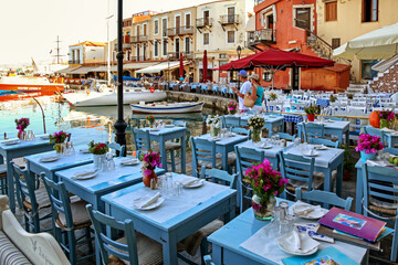 Tavernas and restaurants in old town in city Rethymno in Crete island at Greece