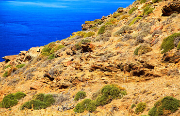 Fototapeta na wymiar Dry mediterranean country and blue water in the sea