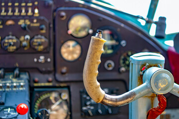 Steering wheel control aircraft in selective focus against the background of a blurred instrument...