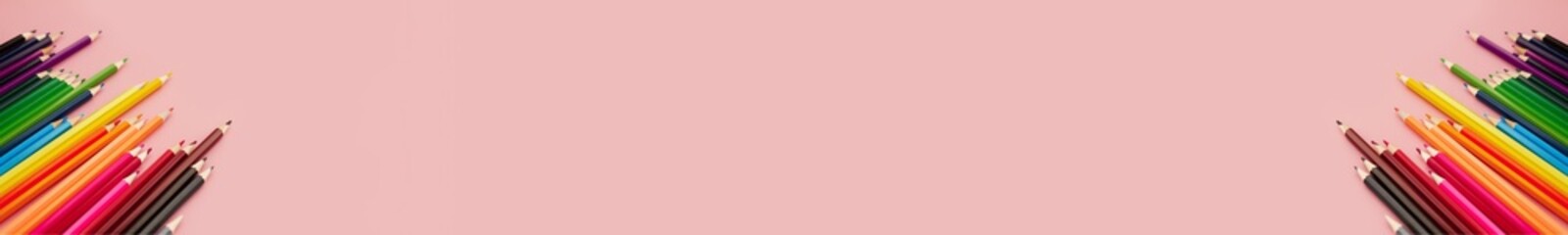 banner two group of multicolored watercolor pencils on pink background