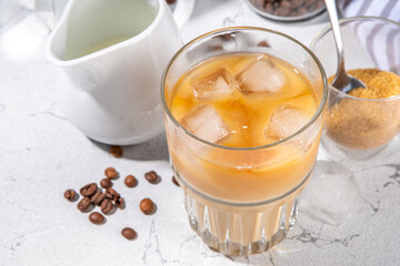 Homemade iced latte coffee, with milk poured Into Iced coffee espresso, Summer cold refreshing drink concept