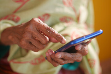  senior women hand using smart phone close up 
