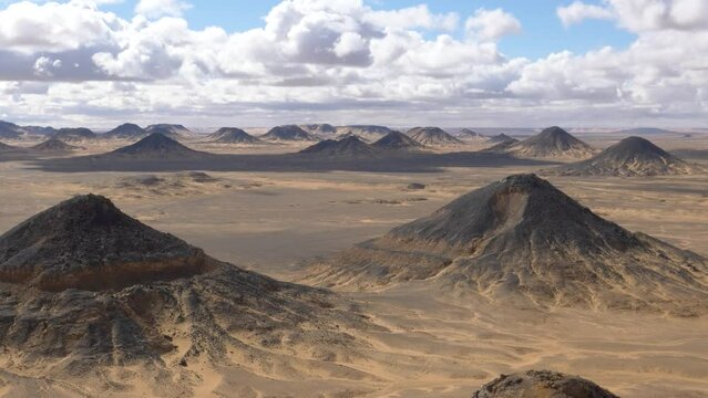 Wide view of the hills in the Black Desert, Egypt.