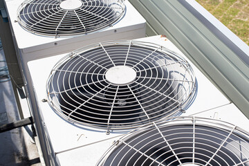 Air conditioner, condenser outdoor unit, fan close up - Powered by Adobe