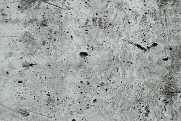 Black, white, gray grunge textured rough stone background with cracks, scratches and stains or creative concrete backdrop. 
