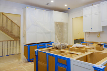 Assembling and installing modern kitchen cabinets a new home