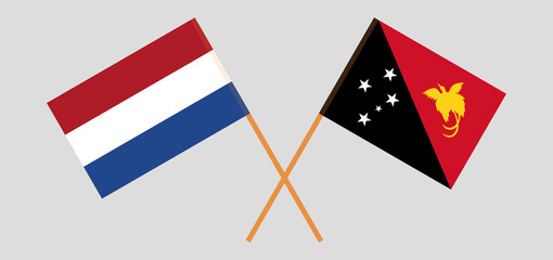 Crossed flags of the Netherlands and Papua New Guinea. Official colors. Correct proportion