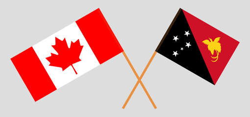 Crossed flags of Canada and Papua New Guinea. Official colors. Correct proportion