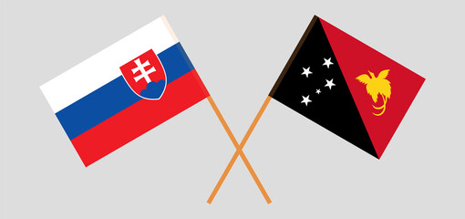Crossed flags of Slovakia and Papua New Guinea. Official colors. Correct proportion
