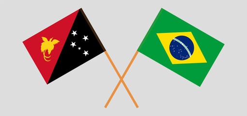 Crossed flags of Papua New Guinea and Brazil. Official colors. Correct proportion