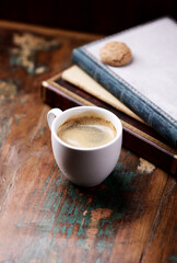 Cup of coffee on rustic wooden background. Copy space.