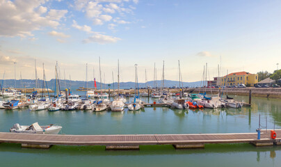 Gulf with yachts and boats moored in a bay on the river Tagus. The picturesque coastline of Marina...