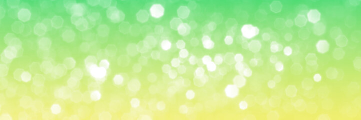 Fototapeta na wymiar Summer green sparkling glitter bokeh background, banner texture. Abstract defocused lights header. Wide screen wallpaper. Panoramic web banner with copy space for design