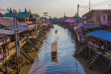 Fototapeta na wymiar Amphawa district,Samut Songkhram Province,Thailand on April 12,2019:Attractive scene of Amphawa Floating Market.
