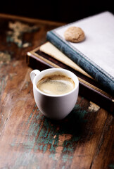 Cup of coffee on rustic wooden background. Copy space.