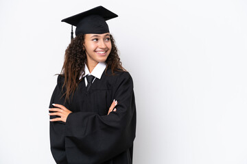Young university graduate Arab woman isolated on white background with arms crossed and happy