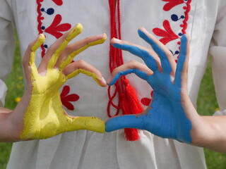 Yellow and blue heart hands. Colours of Ukrainian flag. Support Ukraine. Love from Ukraine. Vyshyvanka Day. Independence Day of Ukraine.
